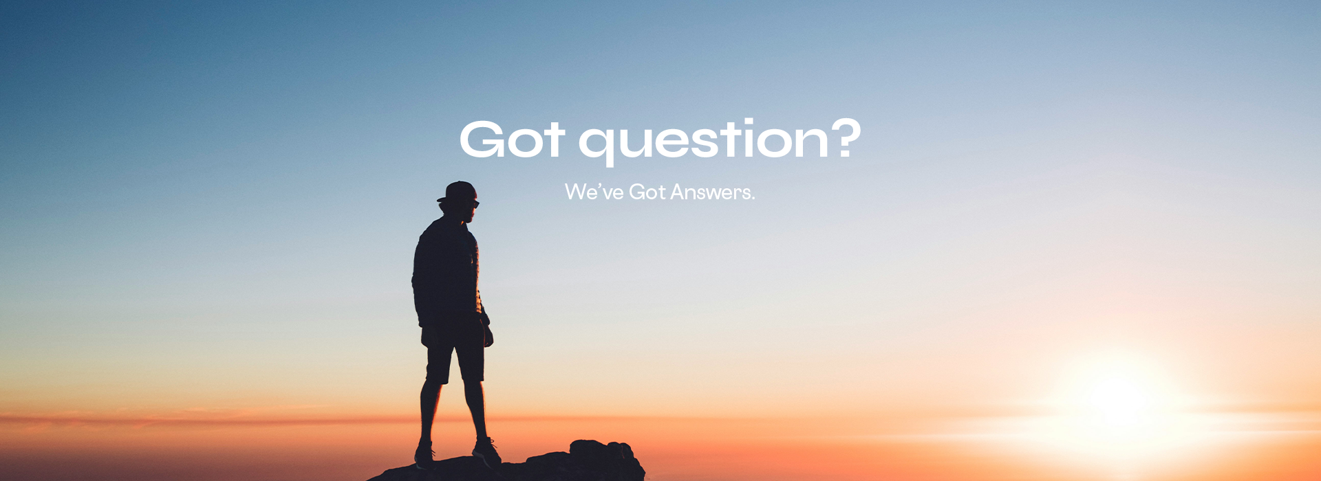 Person standing on a cliff at sunset with 'Got question? We've Got Answers' text.